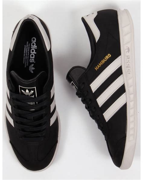 white and black adidas|black adidas with white stripes.